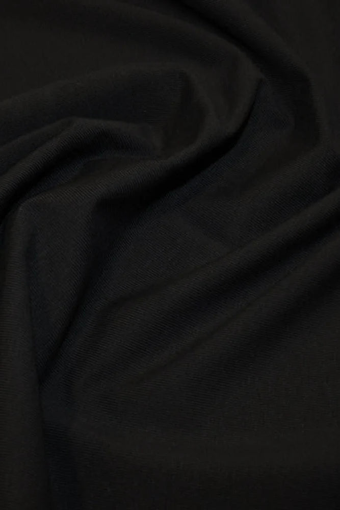 Classic light Jersey Hijab in Black by Amanah, styled in a soft draped wrap.