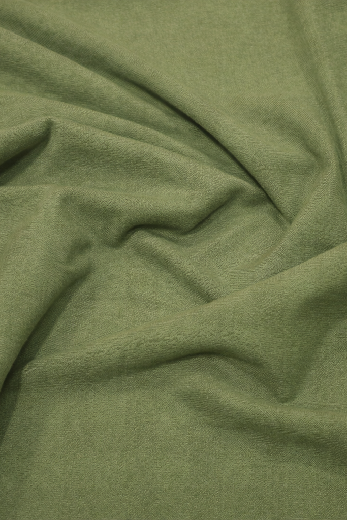 Classic Light Jersey Hijab in Olive by Amanah, styled in a soft draped wrap.