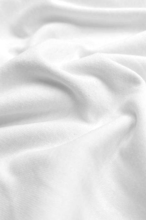 Classic Light Jersey Hijab in White by Amanah, styled in a soft draped wrap.