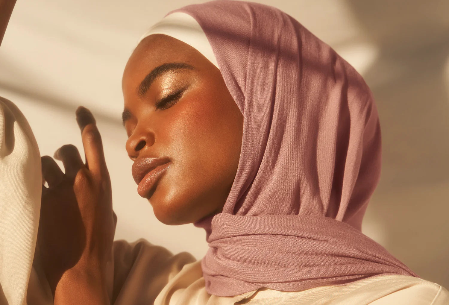 Close-up of woman wearing soft lightweight hijab fabric in neutral tones, showcasing texture and comfort for everyday modest wear