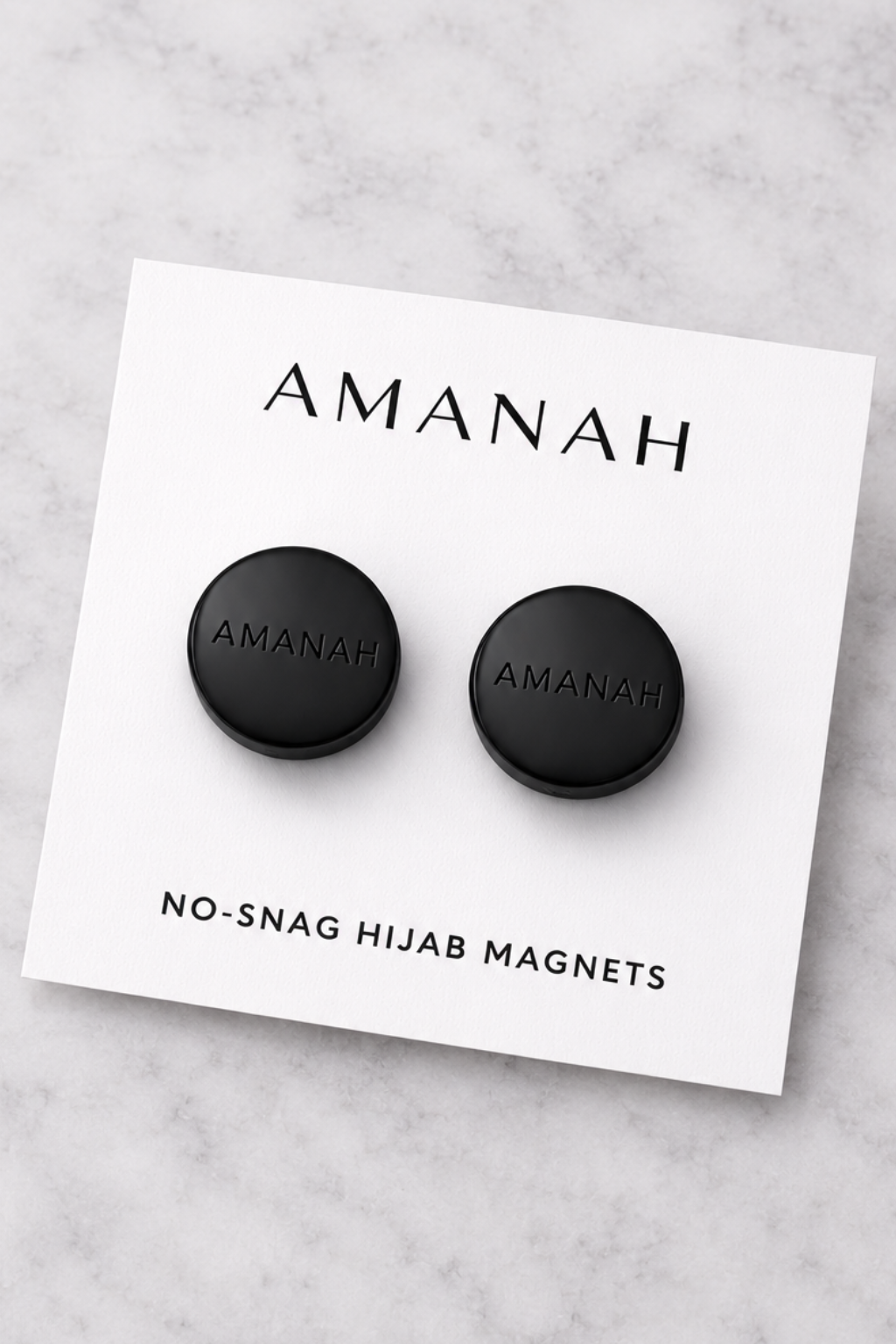 Matte black no-snag hijab magnets with engraved Amanah logo