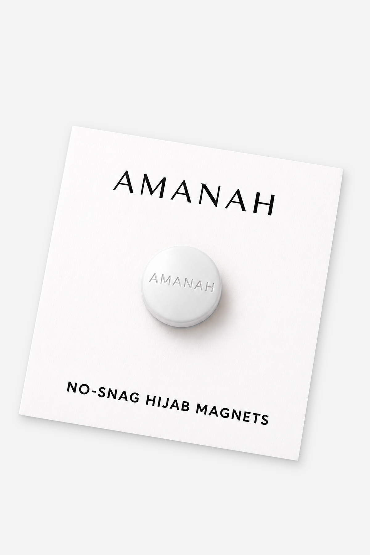 Matte white no-snag hijab magnets with engraved Amanah logo
