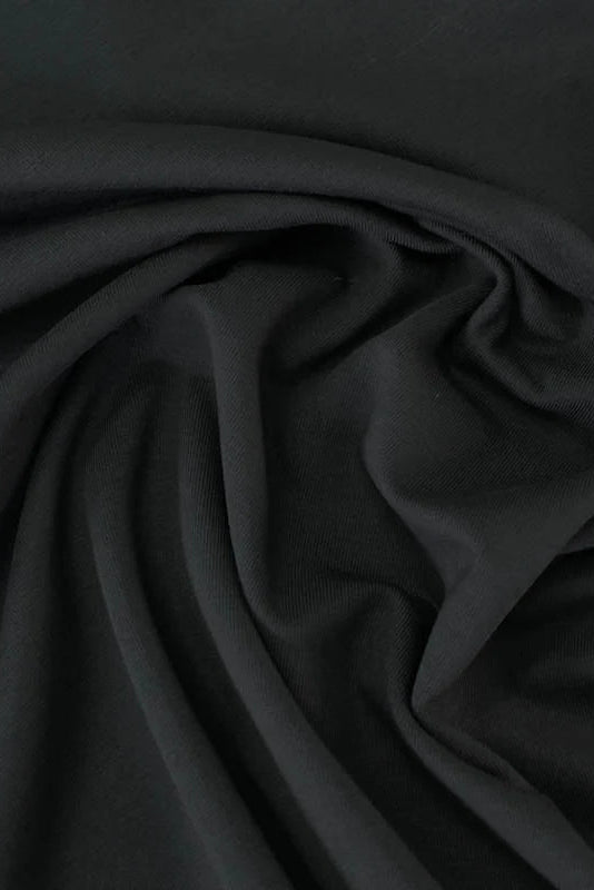 Premium Bamboo Jersey Hijab in Black by Amanah, styled in a soft draped wrap.